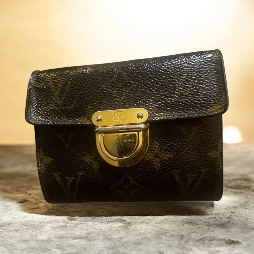 Louis Vuitton Monogram Koala wallet. With gold tone press lock closure